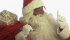 Santa holding bag of gifts