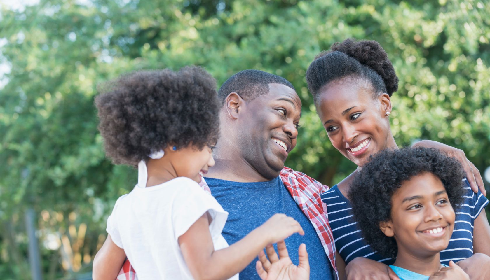 Mixed race African American family outdoors