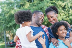 Mixed race African American family outdoors