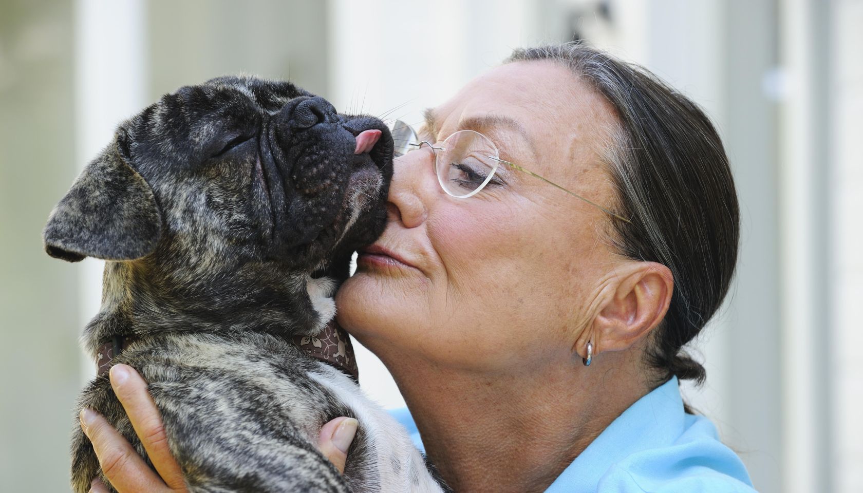 Affectionate senior woman with her pet dog