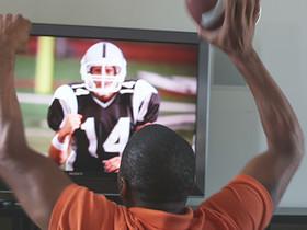 CU SHAKY Man watching sports on TV, Phoenix, Arizona, USA